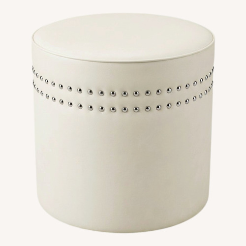 Used Round Faux Leather & Nail Head Ottoman for sale on AptDeco