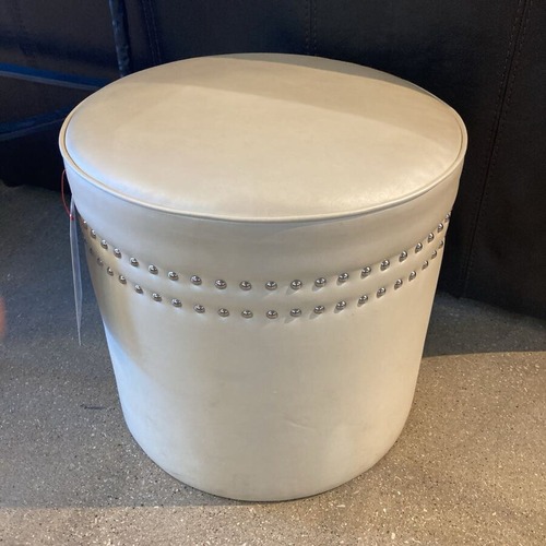 Used Round Faux Leather & Nail Head Ottoman for sale on AptDeco