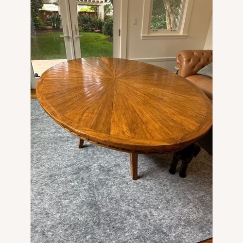 Used Sunburst Top Wood Dining Table for sale on AptDeco
