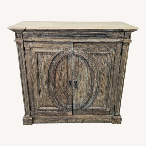 Used Two Door Cabinet with Molded Designs on Doors	 for sale on AptDeco