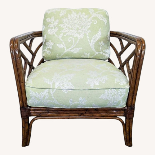 Used Rattan Lounge Chair with Floral Green Cushions	 for sale on AptDeco