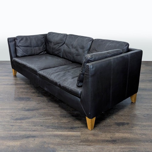 Used IKEA 3-Seat Dark Leather Sofa with Wooden Legs for sale on AptDeco