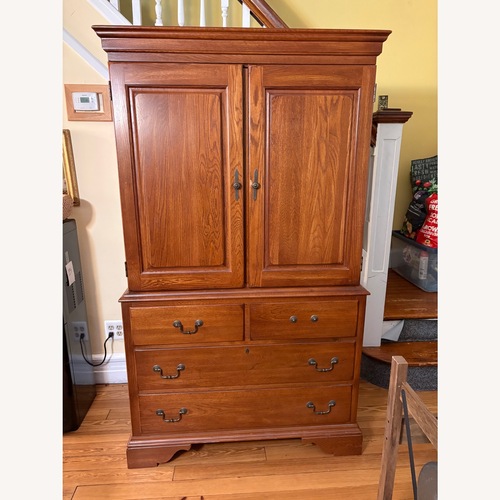 Used Vintage Dark Brown Wood Armoire for sale on AptDeco