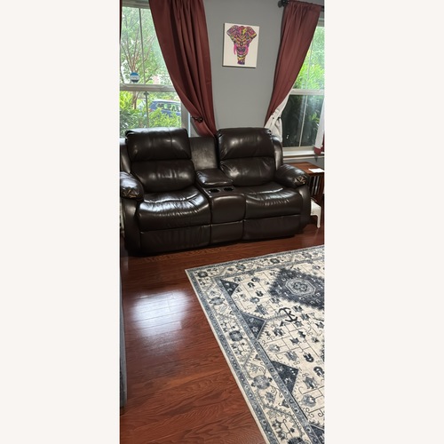 Used Ashley Furniture Dark Brown Leather Love seat for sale on AptDeco
