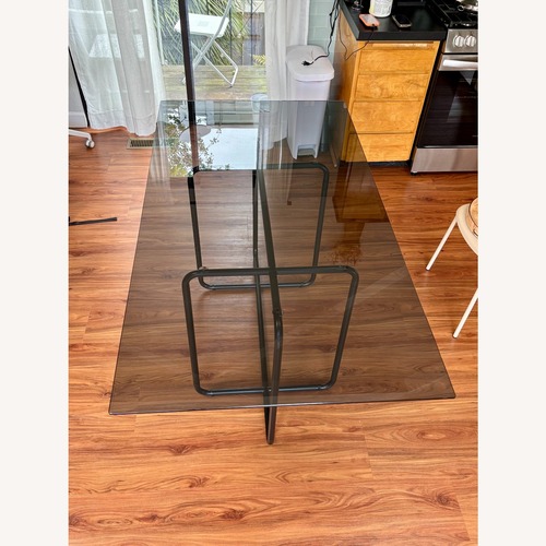 Used West Elm Black Glass Dining Table for sale on AptDeco