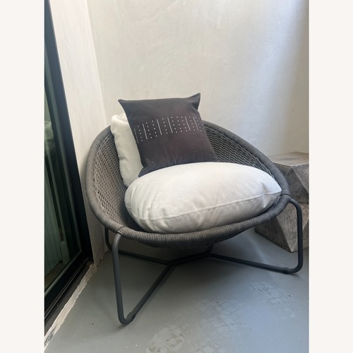 Used Morocco Graphite Oval Outdoor Lounge Chair with White Cushion for sale on AptDeco