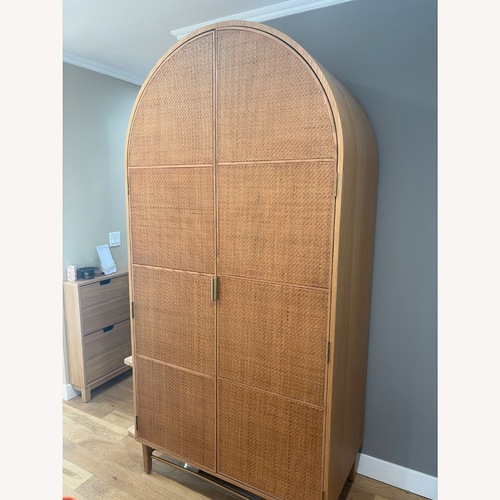 Used Anthropologie Wallace Cane and Oak Armoire for sale on AptDeco