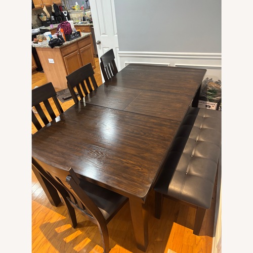 Used Ashley Furniture Dark Brown Wood Dining Sets for sale on AptDeco