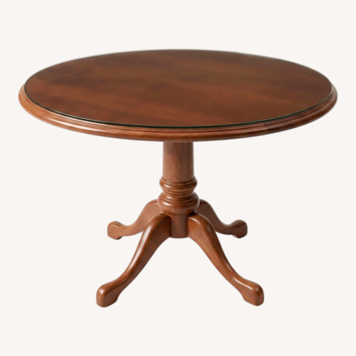 Used Round Solid Wood Glass Top Pedestal Dining Table for sale on AptDeco