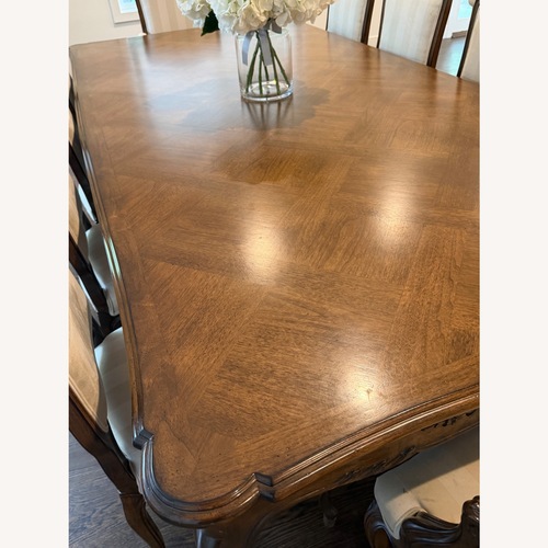 Used Antique Dark Brown Wood Dining Table for sale on AptDeco