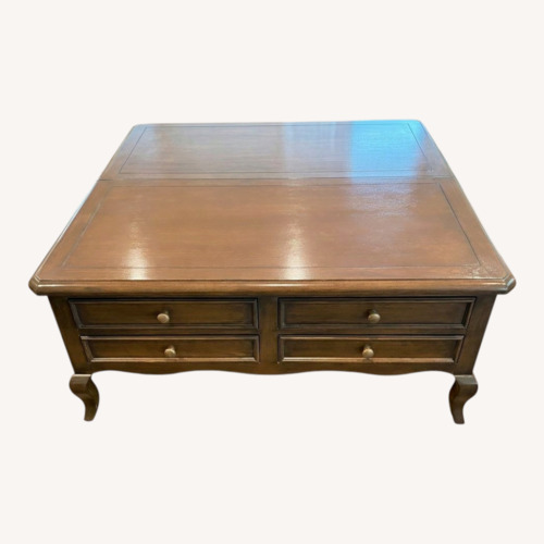 Used Antique Dark Brown Wood Coffee Table for sale on AptDeco