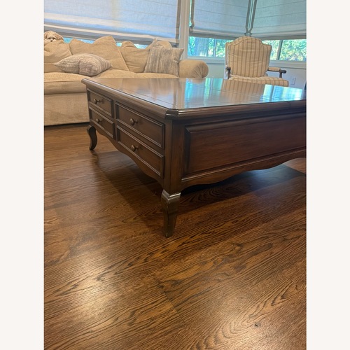 Used Antique Dark Brown Wood Coffee Table for sale on AptDeco