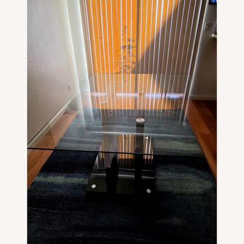 Used Black Glass Dining Table for sale on AptDeco