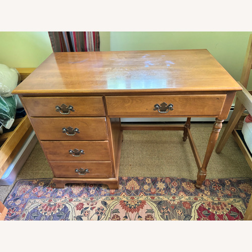 Used Vintage Ethan Allen 4-Drawer Nutmeg Maple Desk for sale on AptDeco