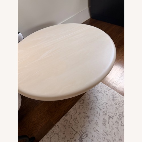 Used CB2 Espira 35" Round Cream Marbled Resin Coffee Table for sale on AptDeco
