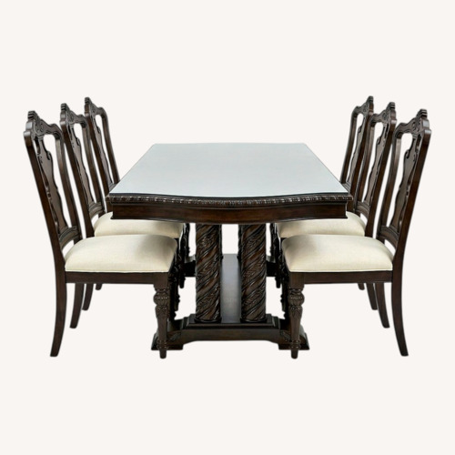 Used Dark Brown Wood Dining Table + 8 Chairs for sale on AptDeco