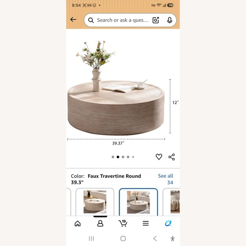 Used Beige Faux Travertine Drum Coffee Table for sale on AptDeco
