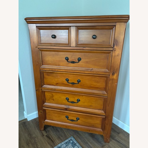 Used Rooms To Go Light Brown Armoire for sale on AptDeco