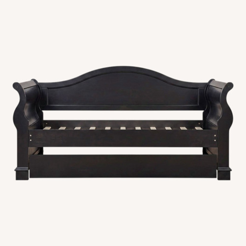 Used Rooms To Go Oberon Black Wood Daybed for sale on AptDeco