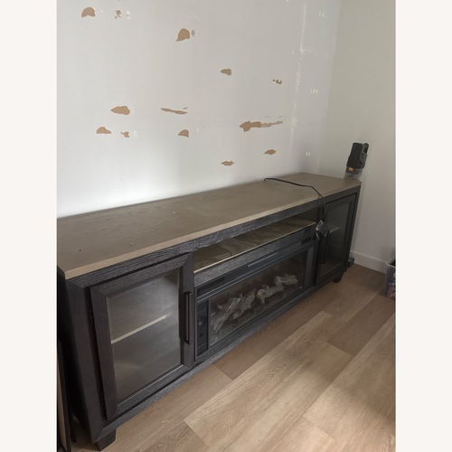 Used Ashley Furniture Foyland 83" TV Stand with Electric Fireplace for sale on AptDeco