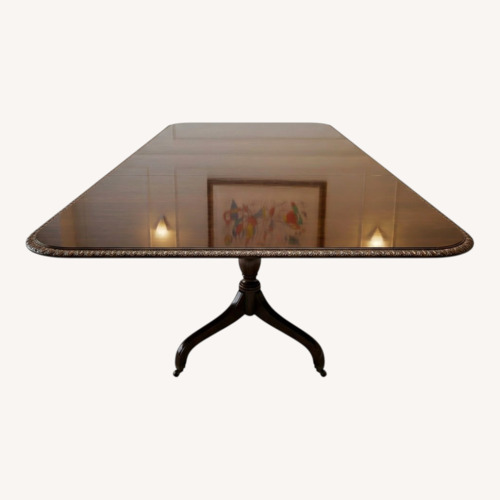 Used Dark Brown Wood Dining Table for sale on AptDeco
