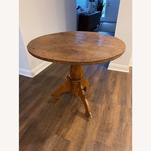 Used Light Brown Wood Dining Table for sale on AptDeco
