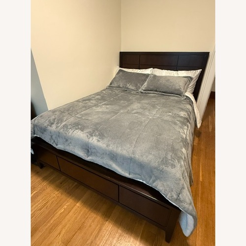 Used Dark Brown Wood Queen Bed for sale on AptDeco