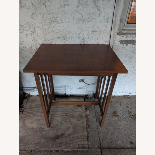 Used Dark Brown Wood Patio Table for sale on AptDeco