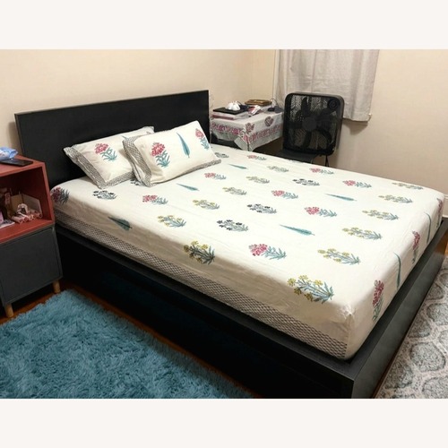 Used IKEA Dark Brown Wood Queen Bed for sale on AptDeco