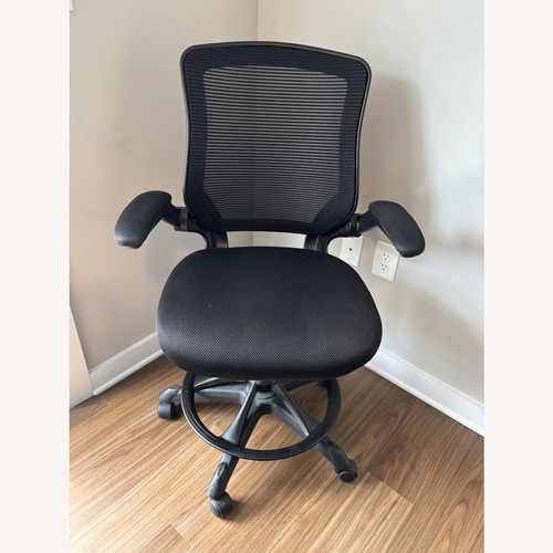 Used Black Adjustable Rolling Office Chair for sale on AptDeco