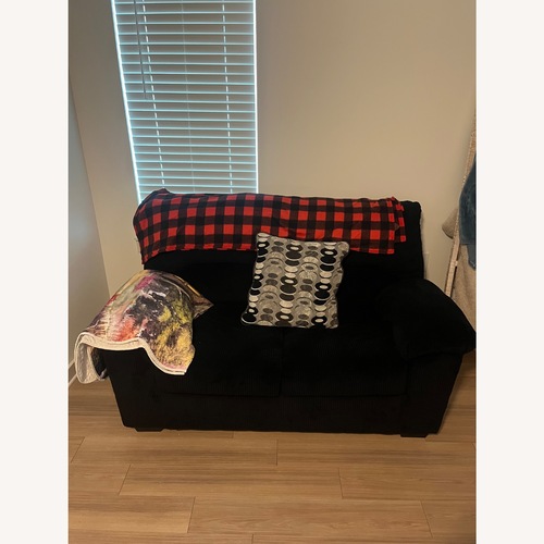 Used Ashley Furniture Onyx Black Loveseat for sale on AptDeco