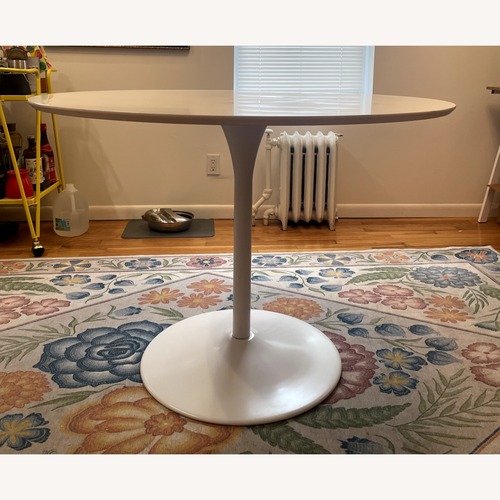 Used White Tulip Table w/ White Metal Base for sale on AptDeco