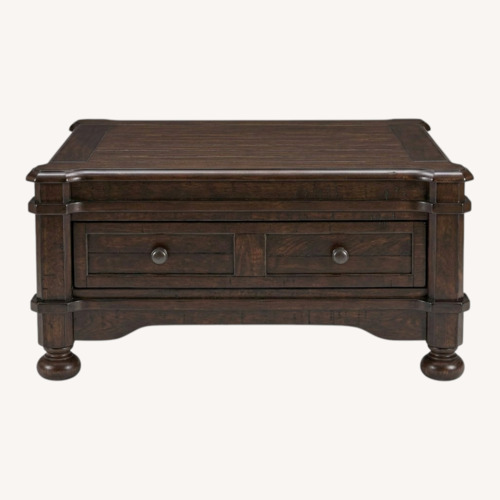 Used Ashley Gerlane Dark Brown Wood Coffee Table for sale on AptDeco