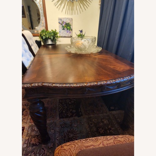 Used Ashley Furniture Dark Brown Wood Dining Table for sale on AptDeco