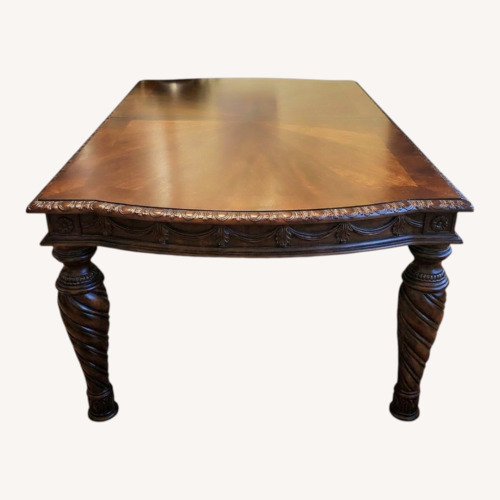 Used Ashley Furniture Dark Brown Wood Dining Table for sale on AptDeco