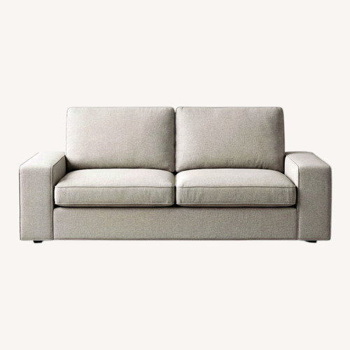 Used Beige Slipcovered Three-Seat Sofa for sale on AptDeco