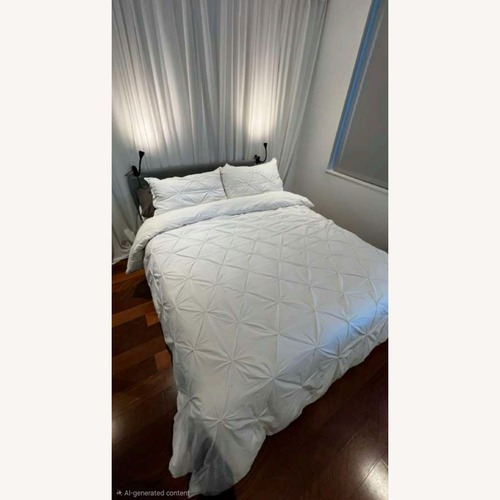 Used Queen Bed Frame with Gray Upholstered Headboard for sale on AptDeco
