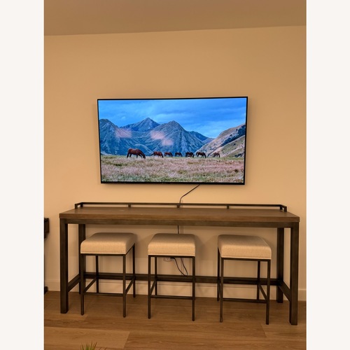 Used Industrial Console Table with 3 Stools for sale on AptDeco