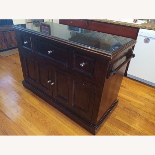 Used Solid Wood and Granite Top Kitchen Island for sale on AptDeco