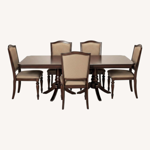 Used Raymour & Flanigan Dark Brown Wood Dining Table for sale on AptDeco