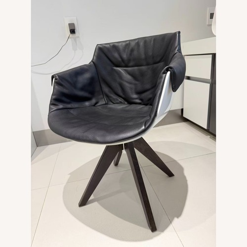 Used MDF Italia Leather Swivel Armchair  for sale on AptDeco