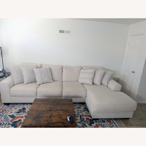 Used Ashley Furniture White Lerenza 4 piece Sectional with Chaise for sale on AptDeco