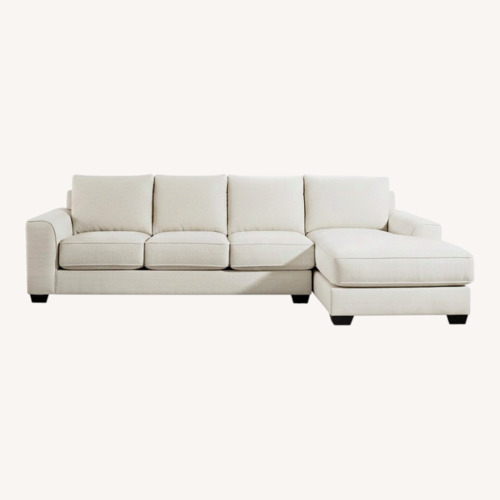 Used Ashley Furniture White Lerenza 4 piece Sectional with Chaise for sale on AptDeco