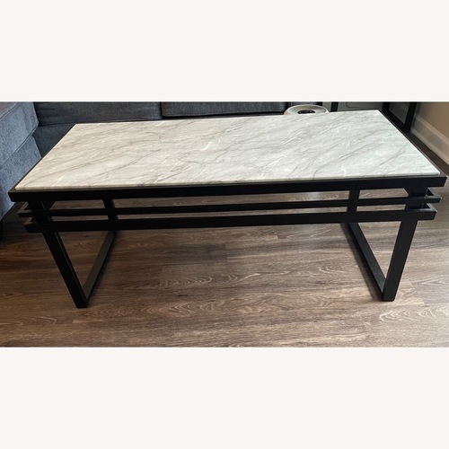 Used Rooms To Go Truanni Black Cocktail Table for sale on AptDeco