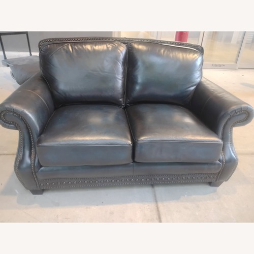 Used Rooms To Go Cindy Crawford Blue Leather Loveseat for sale on AptDeco