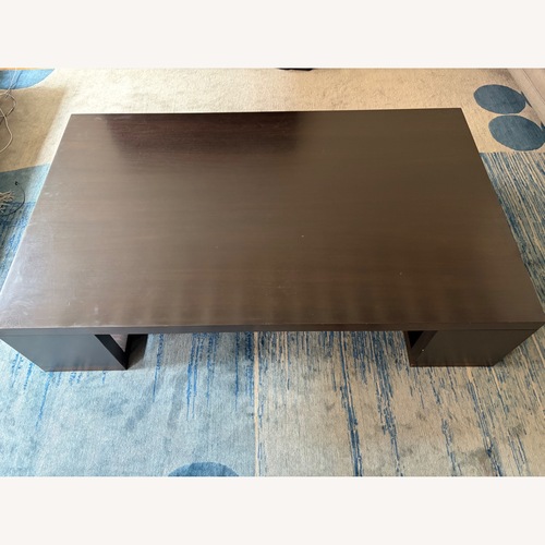 Used Dark Brown Wood Coffee Table for sale on AptDeco