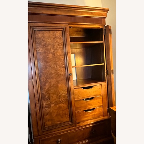 Used Ethan Allen Dark Brown Wood Armoire for sale on AptDeco