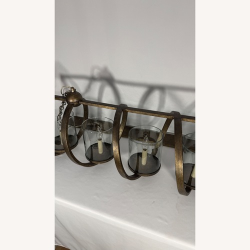 Used Maximus Medium Bronze Chandelier for sale on AptDeco