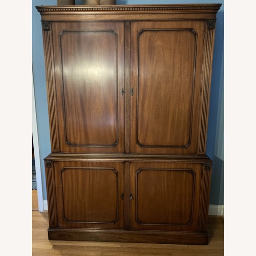 Used Antique Dark Brown Wood Armoire for sale on AptDeco