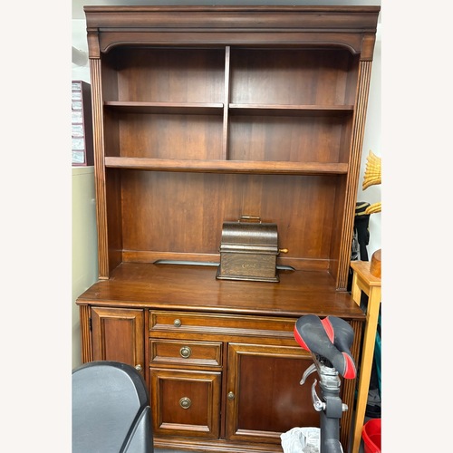 Used Dark Brown Wood Armoire for sale on AptDeco